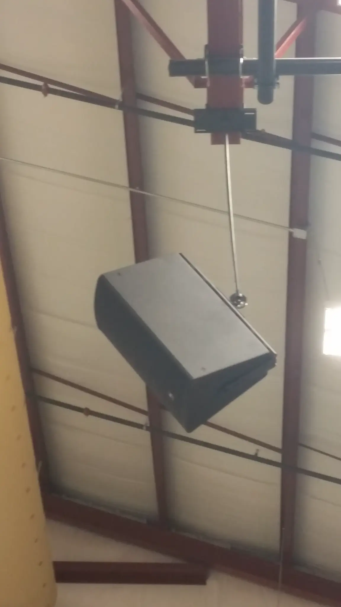 JBL Professional PA speaker mounted on gymnasium ceiling beam at Cornerstone Prep Academy