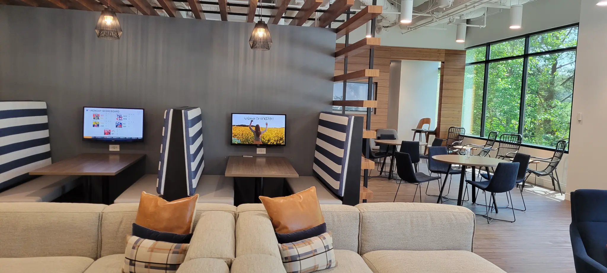 Lounge seating and booth displays at Bridge Commercial Lenox