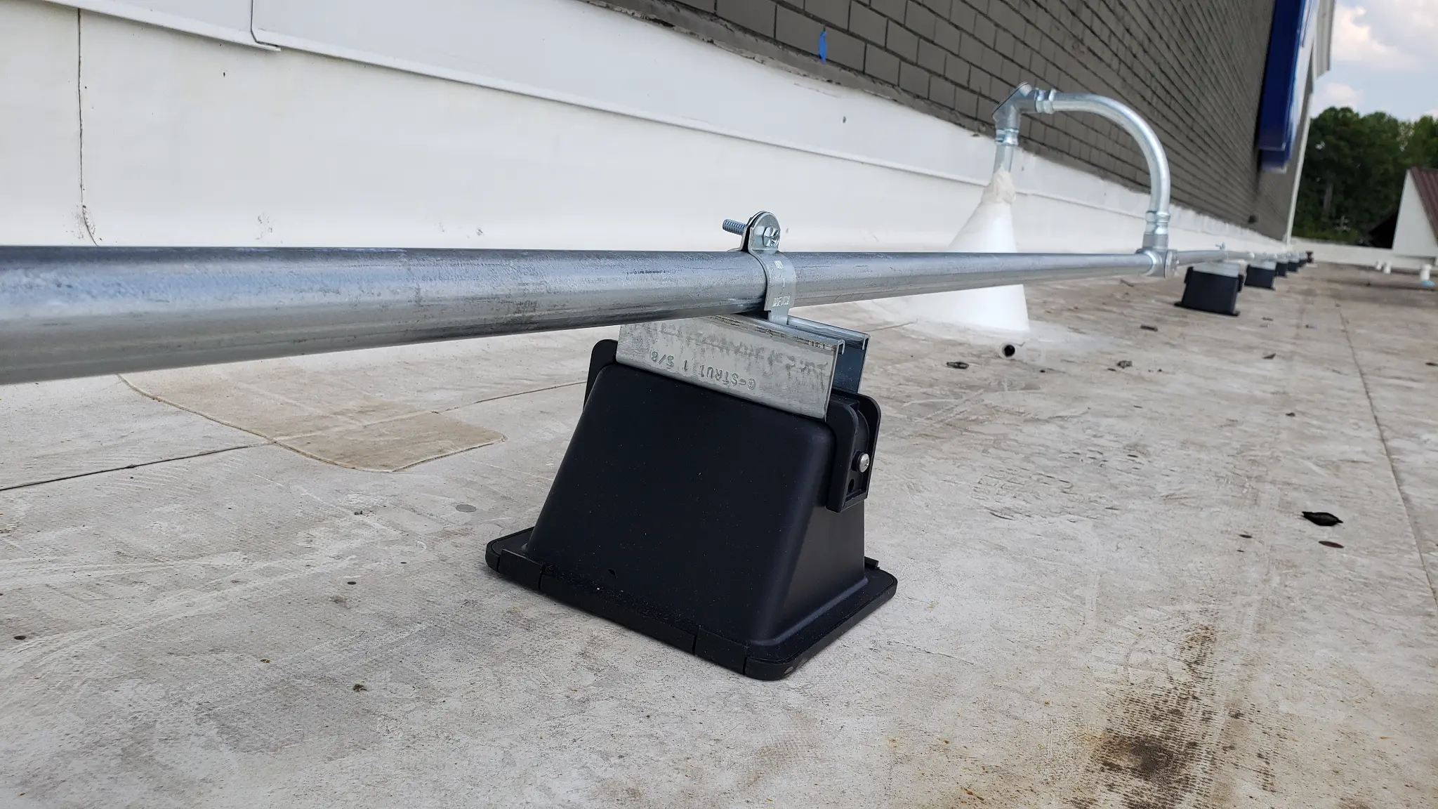 Roof-mounted conduit and camera housing at Chamblee Plaza