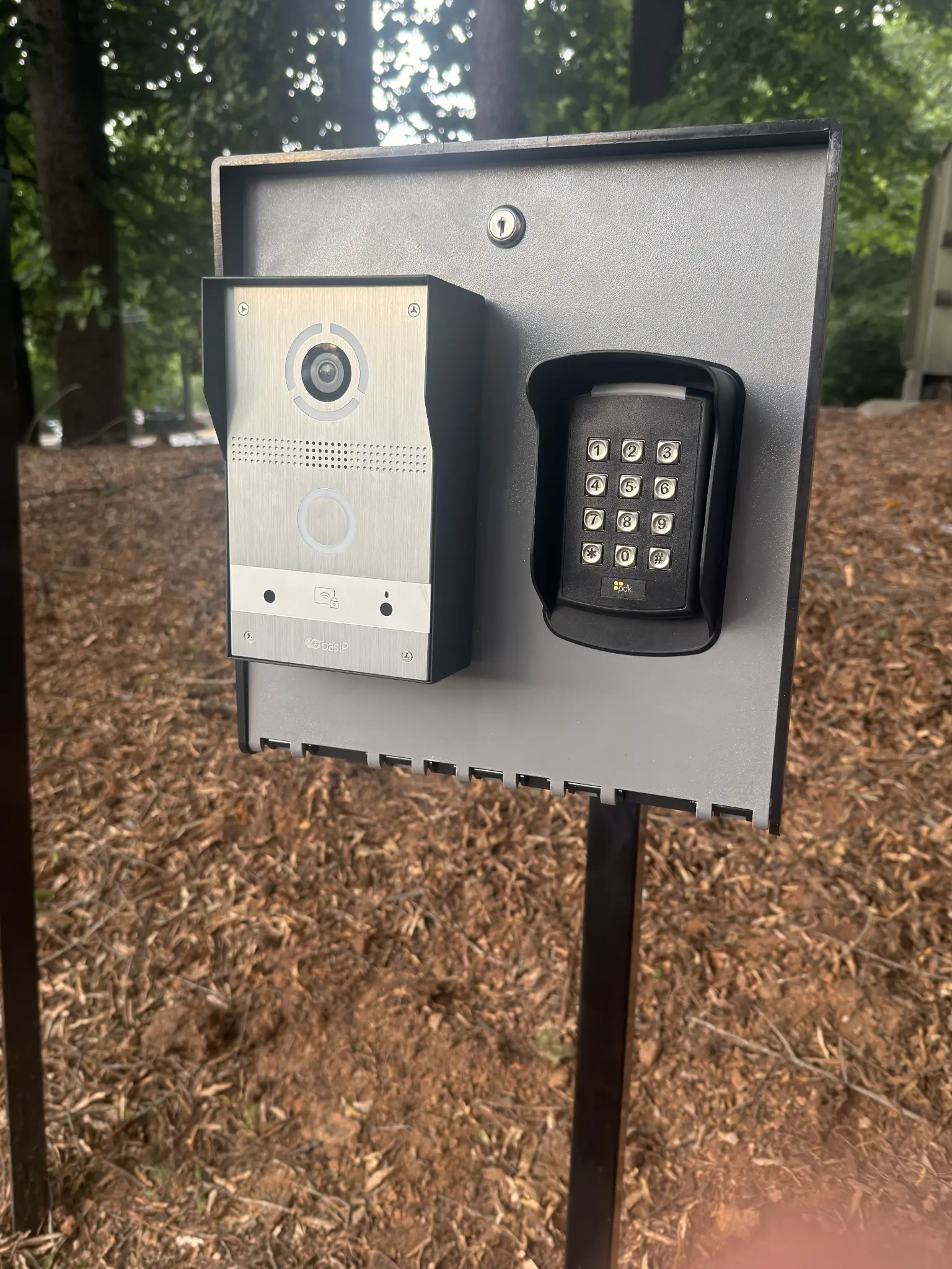 BAS-IP video intercom and PDK keypad reader mounted at TBT gate entrance