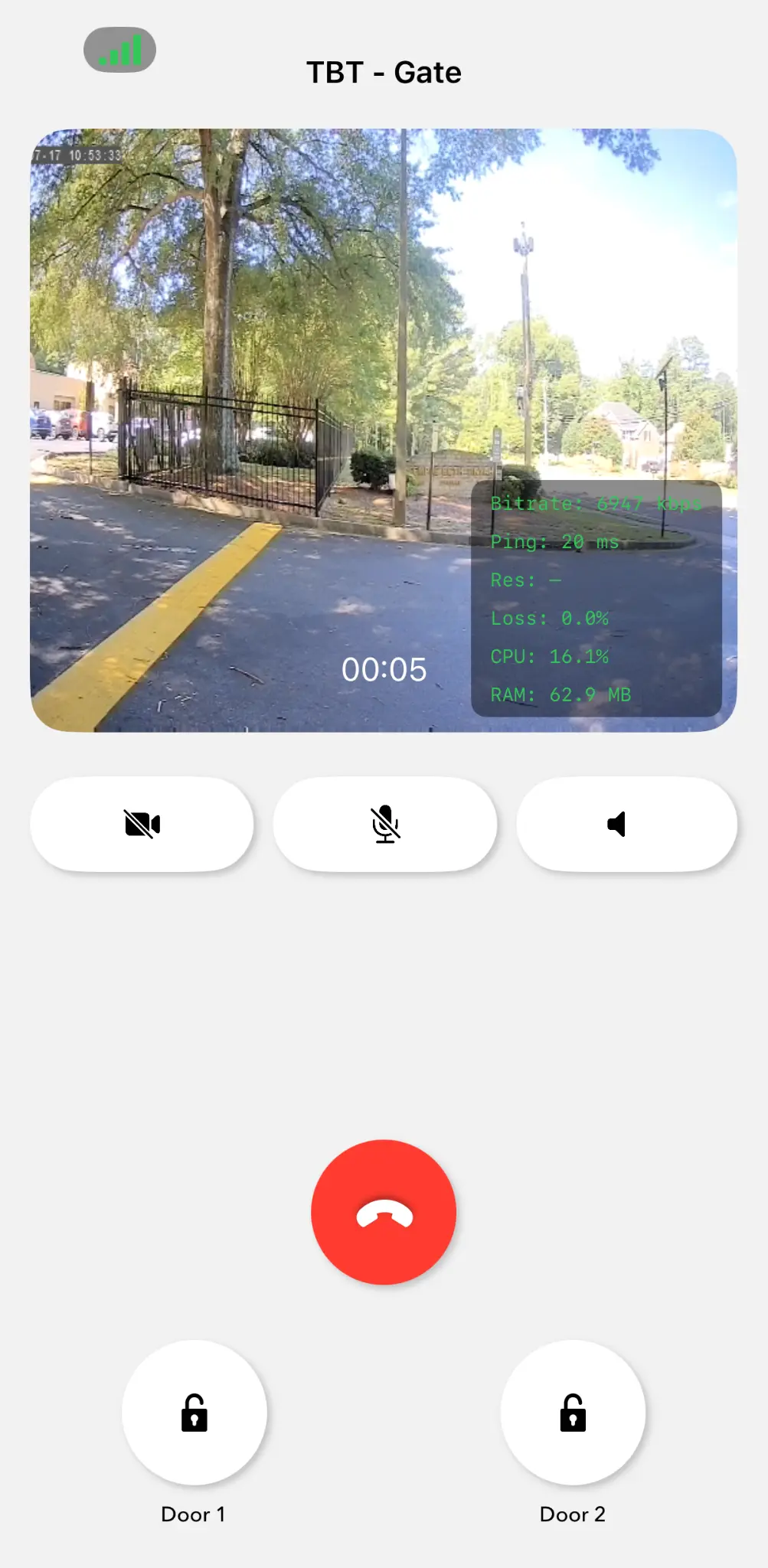 Mobile app showing live video feed from TBT gate with door unlock controls