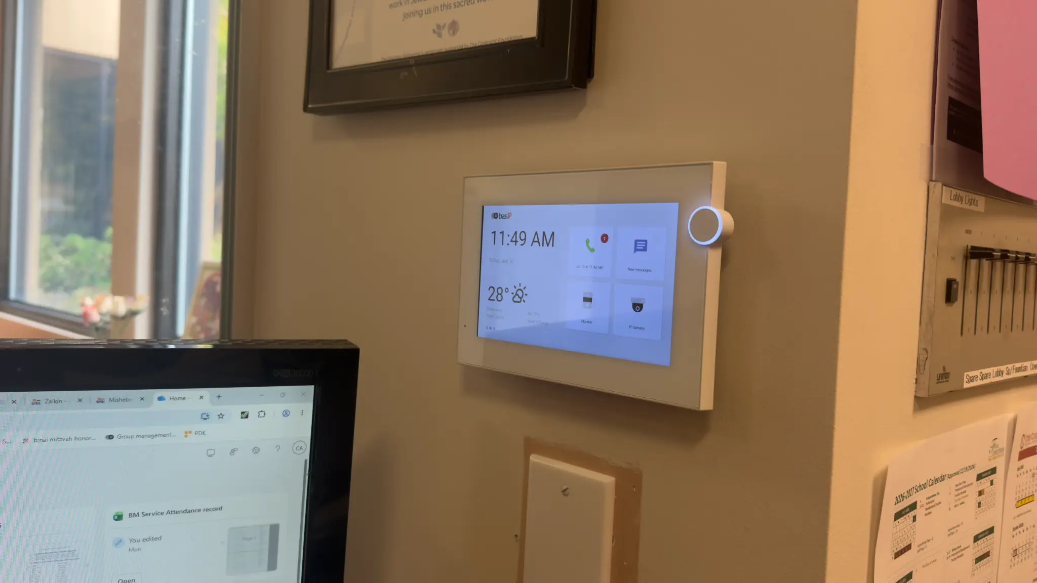 BAS-IP indoor video intercom monitor mounted on office wall at TBT