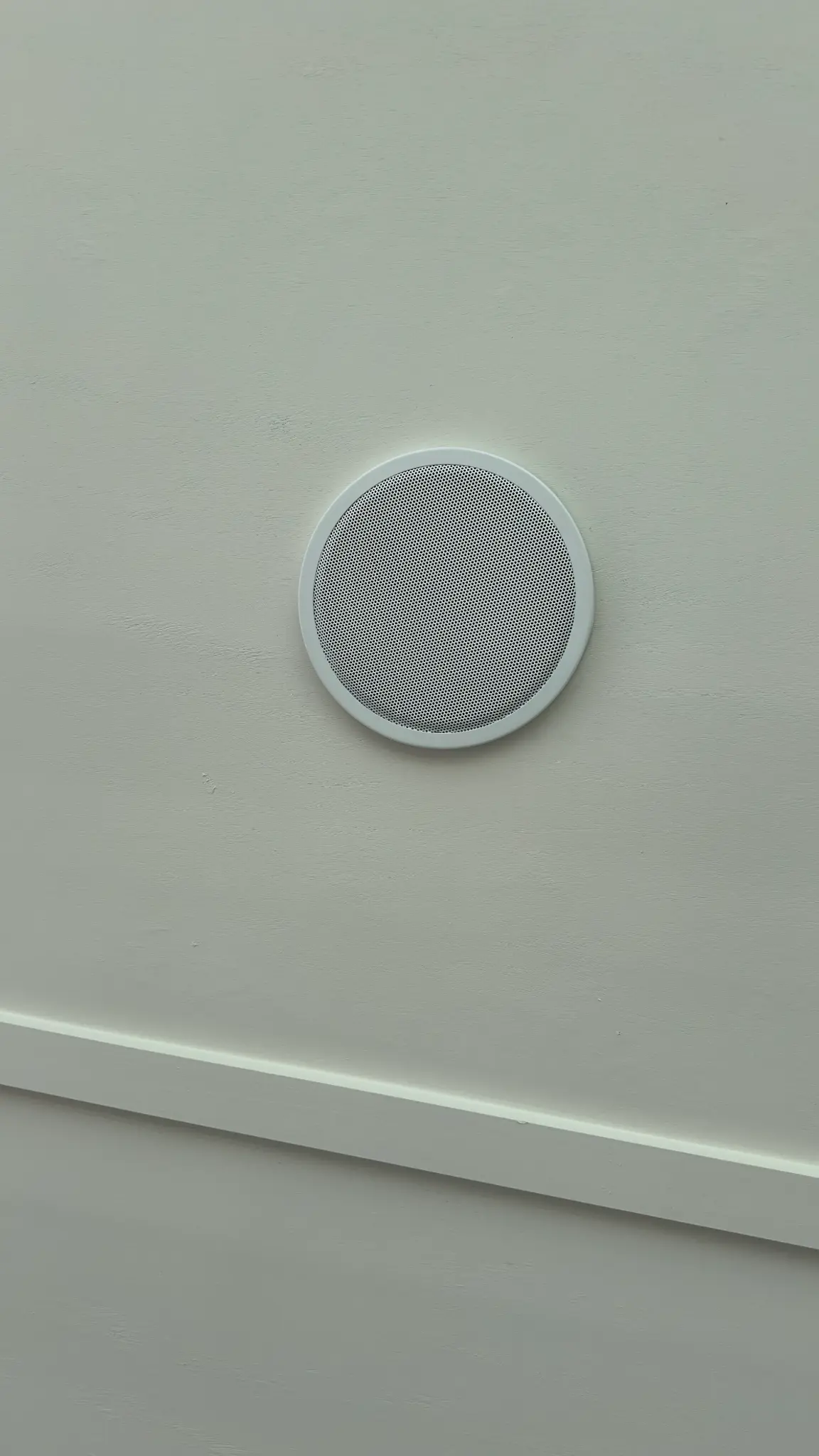 Sonance commercial outdoor speaker mounted on clubhouse wall at TUXFORD HOA