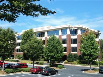 Parkside Terrace East building exterior with landscaping and parking