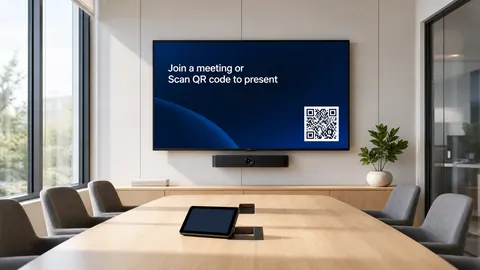 Bright modern conference room with a wall display showing a join-a-meeting welcome screen with a QR code